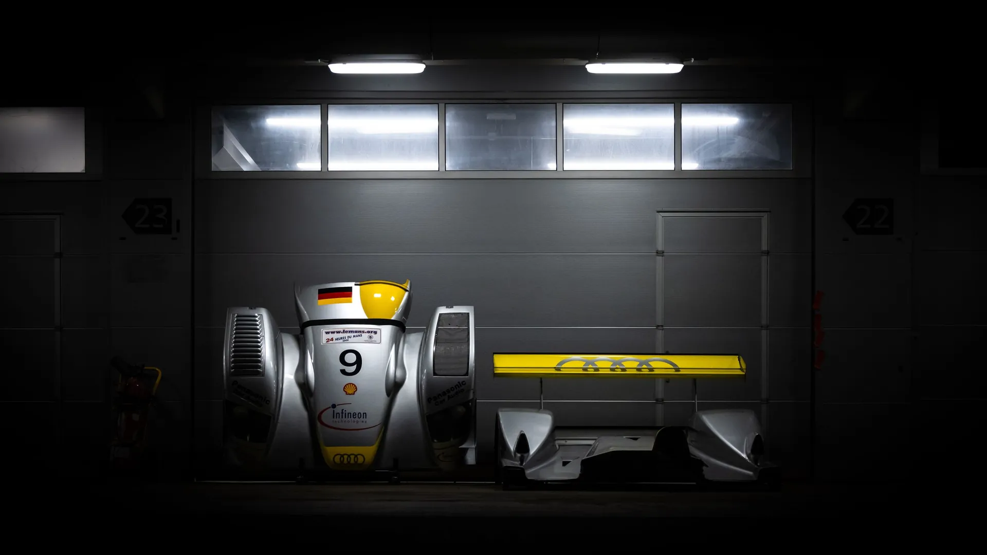 Car under workshop lights in the Seek Cars garage